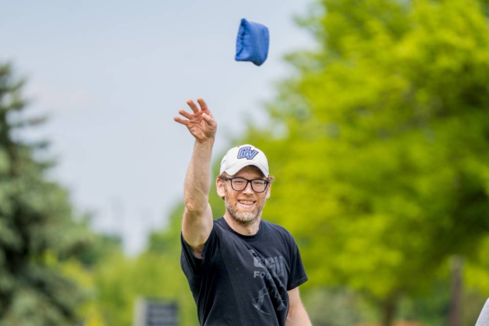 Dan Vainner throws a bag and watches it fly